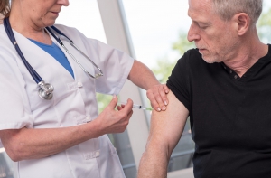 Elderly man receiving vaccine