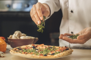 Chef making a pizza