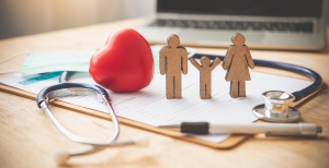 Wooden figures of a family on desk